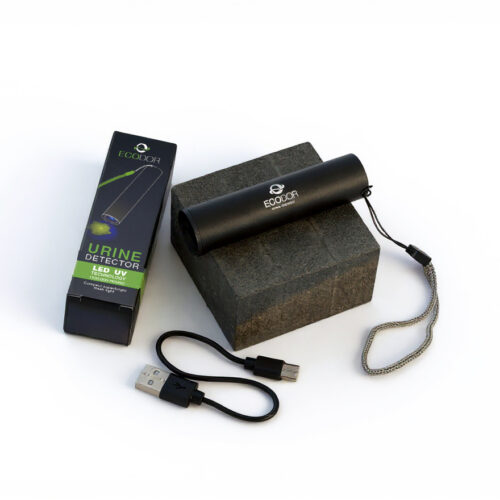 Ładowalny detektor moczu UV Ecodor EcoLight ustawiony na stole